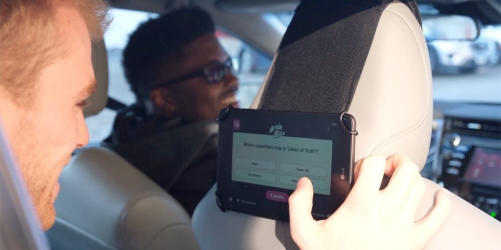 Passenger engaging with Octopus tablet in car